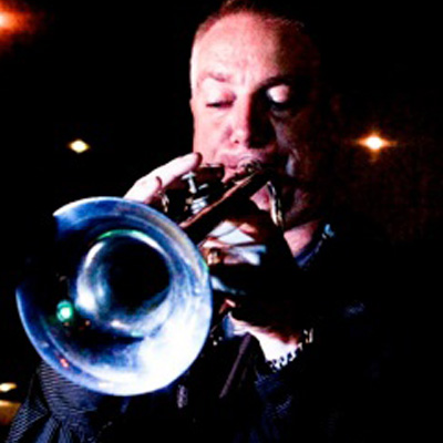 Kevin Armbruster playing a trumpet